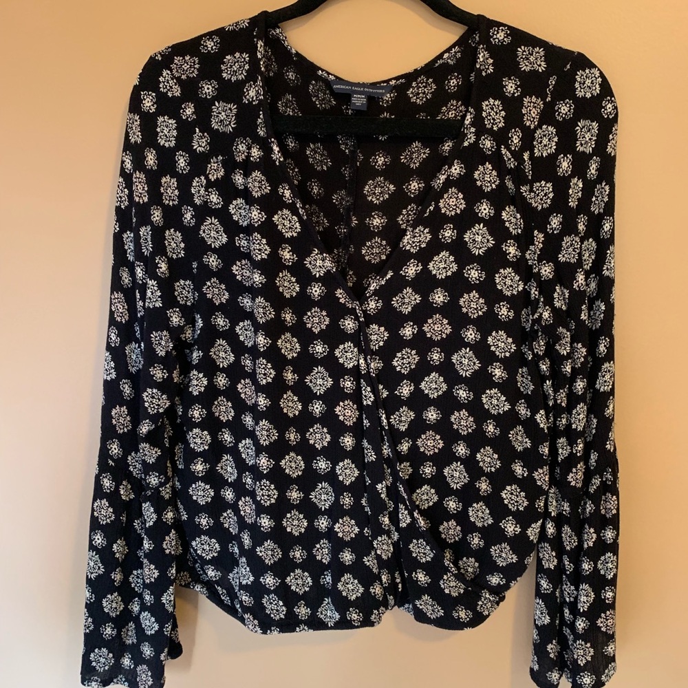 Black bell sleeved top
